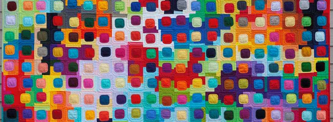 colorful quilt with rounded squares called squircles